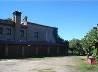 Fabbricato su tre livelli con adiacente terreno di...