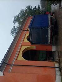 Villetta con fabbricati ad uso agricolo, capannoni e terreni. 