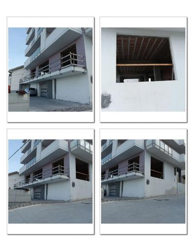 Porzione di fabbricato in costruzione, oltre balcone e area urbana.