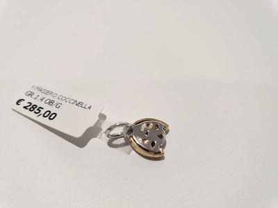 (Lotto n.1845) un ciondolo in oro giallo e bianco 18 kt a forma di...